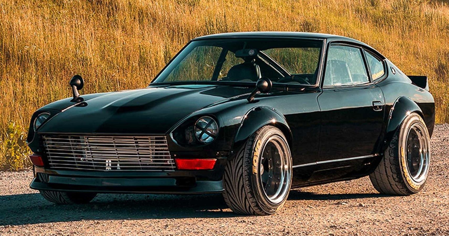 Black Datsun 240Z in front of yellow grass