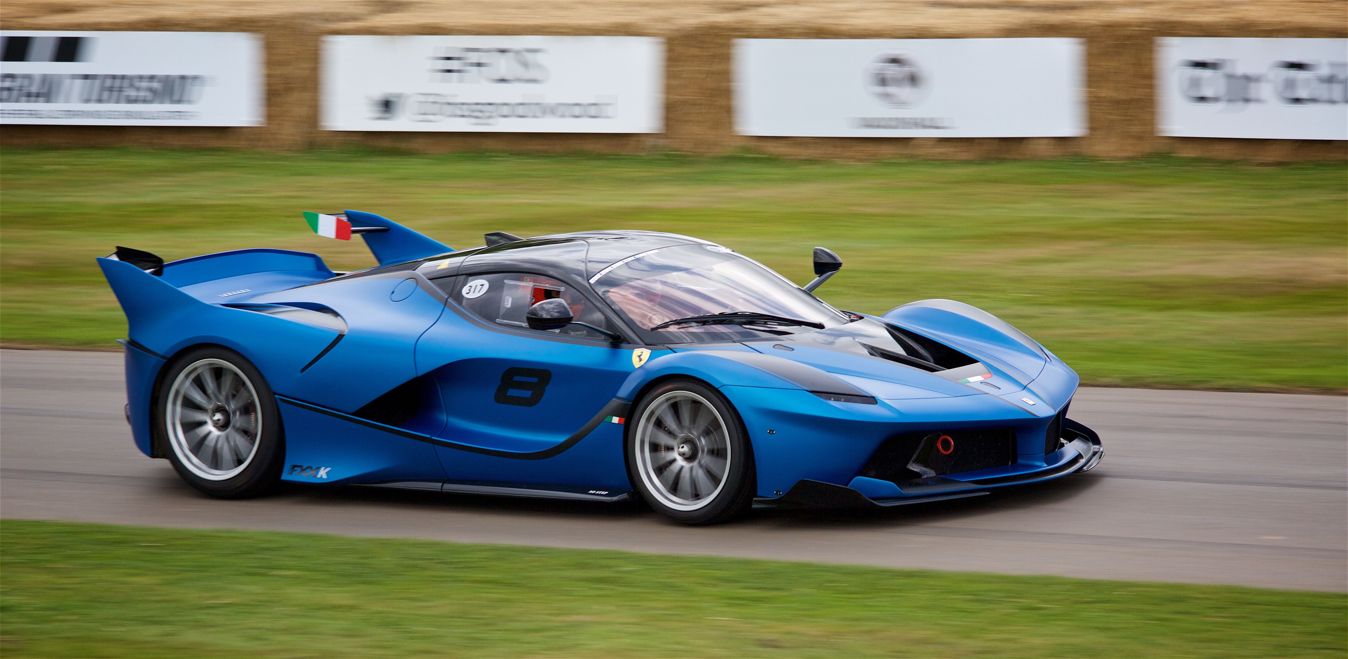 Blue Ferrari FXX K Evo on racetrack