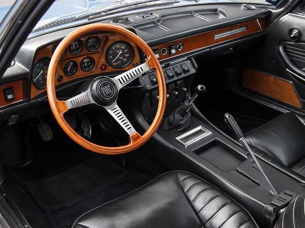 The interior design and layout of a Fiat Dino coupe