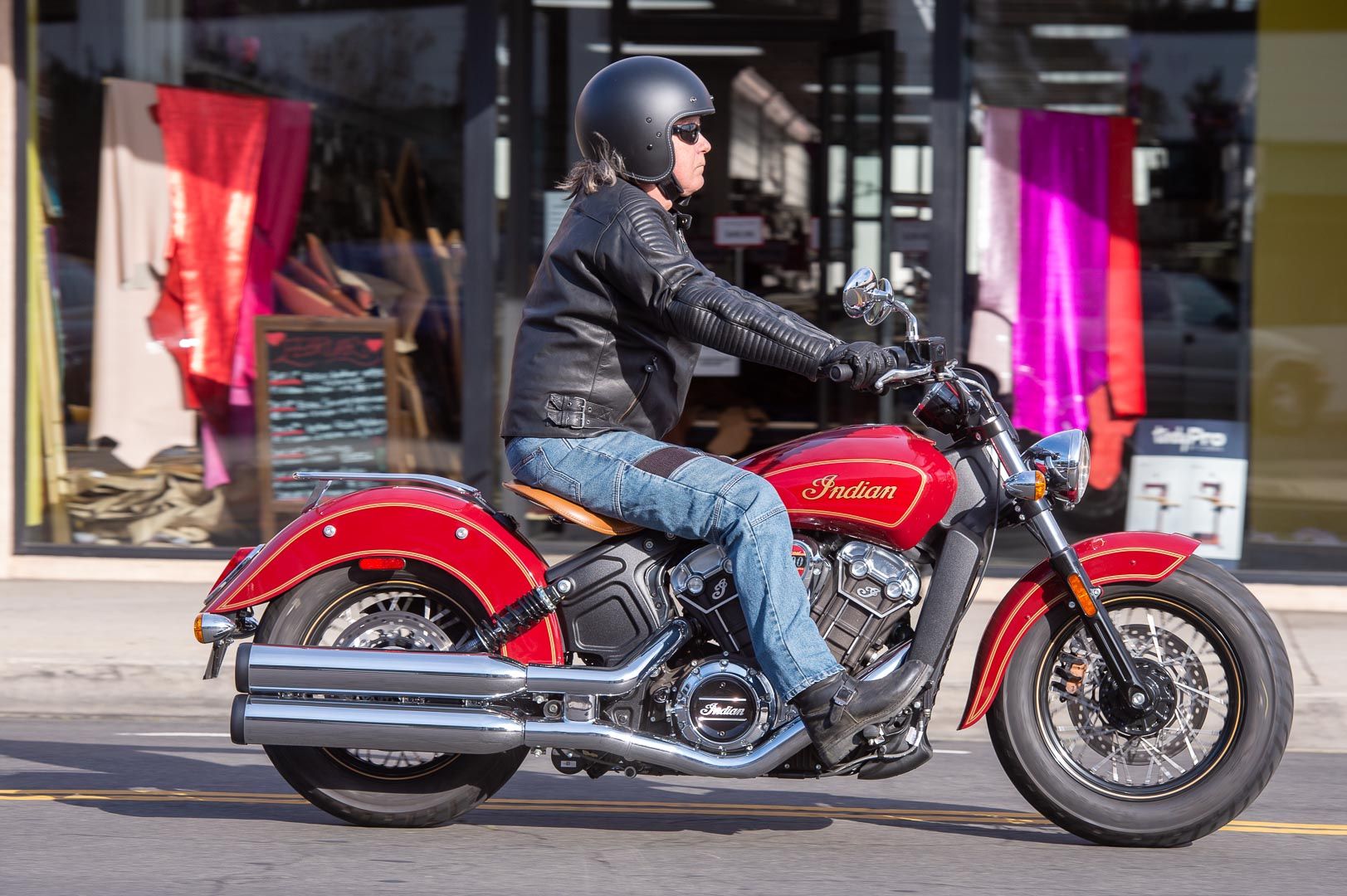 a rider on a Indian Scout 100th Anniversary.