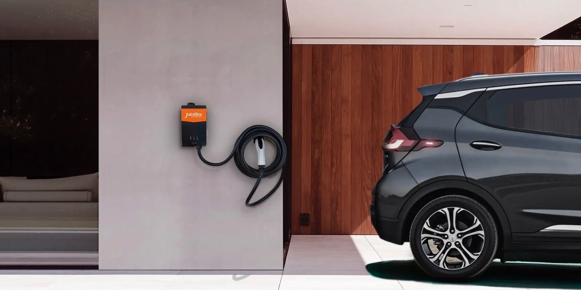 A Chevy Bolt next to a JuiceBox home charger