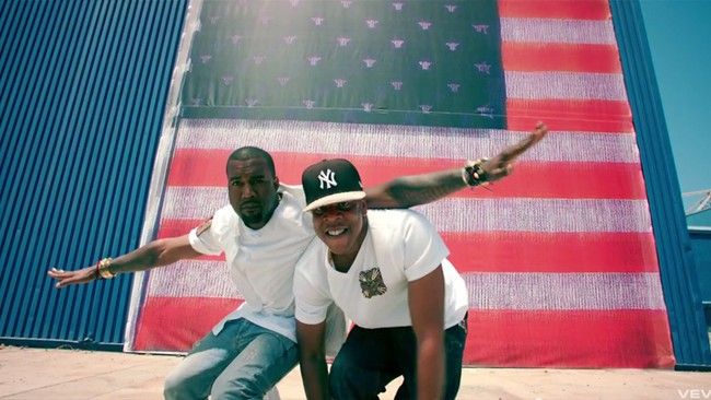 Kanye West and Jay-Z pose while filming the Otis music video.