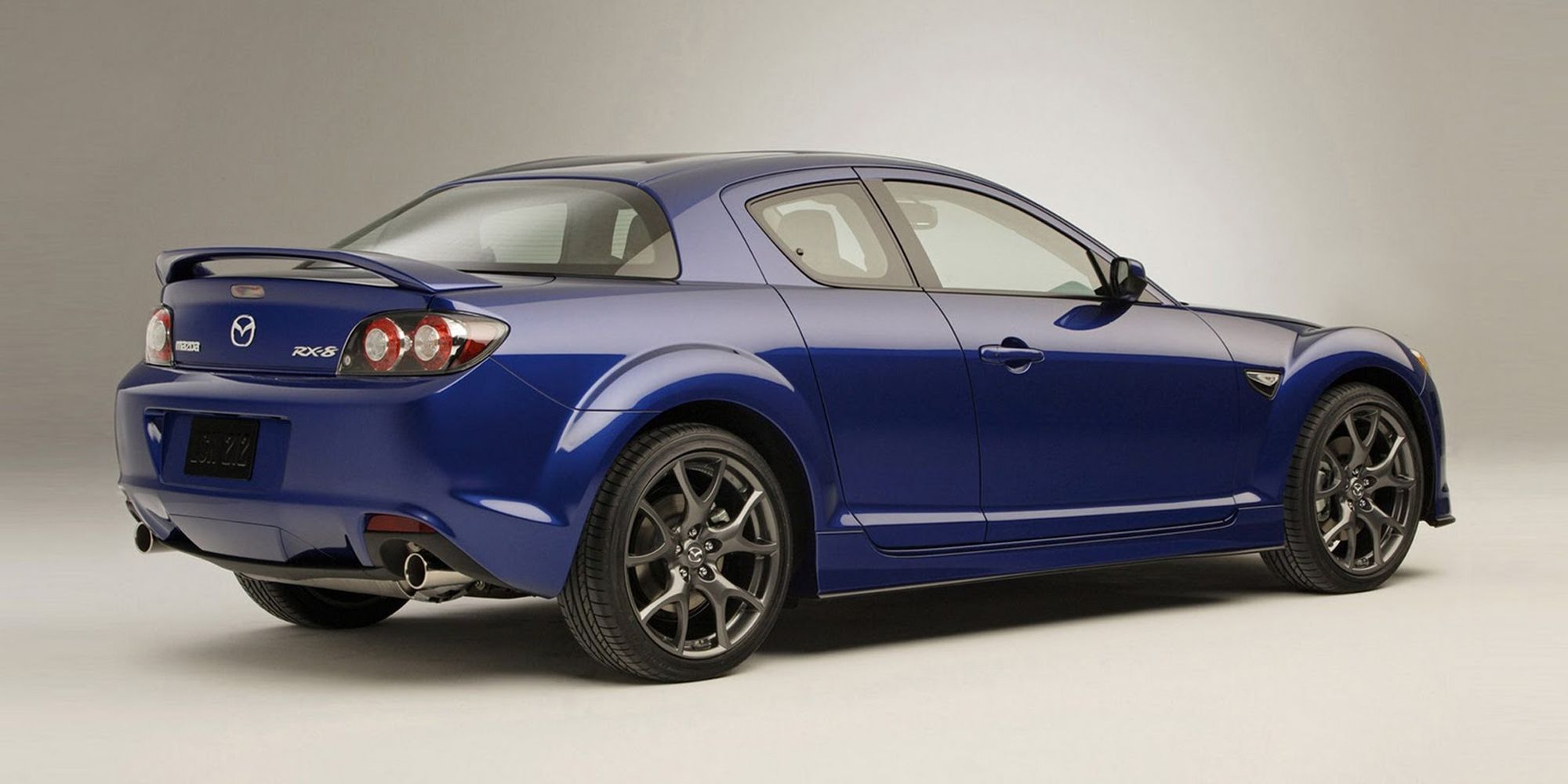 Rear 3/4 view of the Mazda RX8 (Blue)