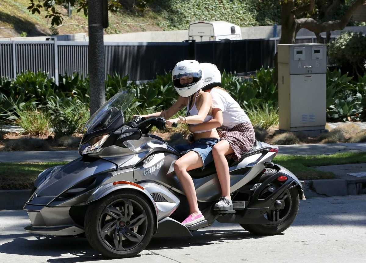 Miley Cyrus on a bike