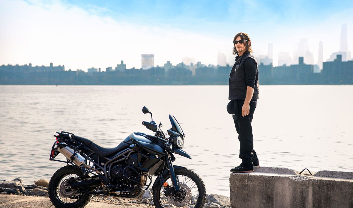 Norman Reedus with his bike at the lake