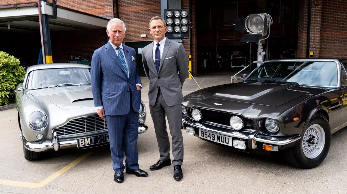 James Bond with an Aston Martin DB5, a V8 Vantage and Prince Charles