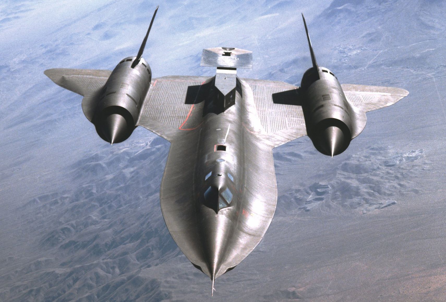 SR-71A in Flight with Test Fixture Mounted Atop the Aft Section of the Aircraft