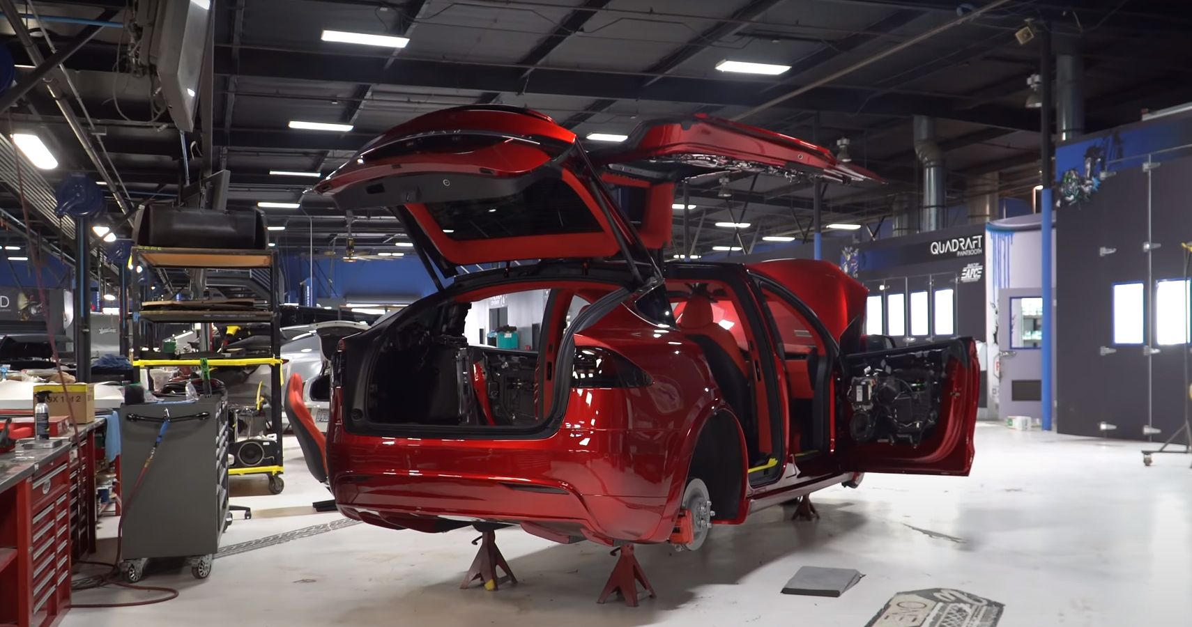 Tesla X being reassembled after candy red paint job