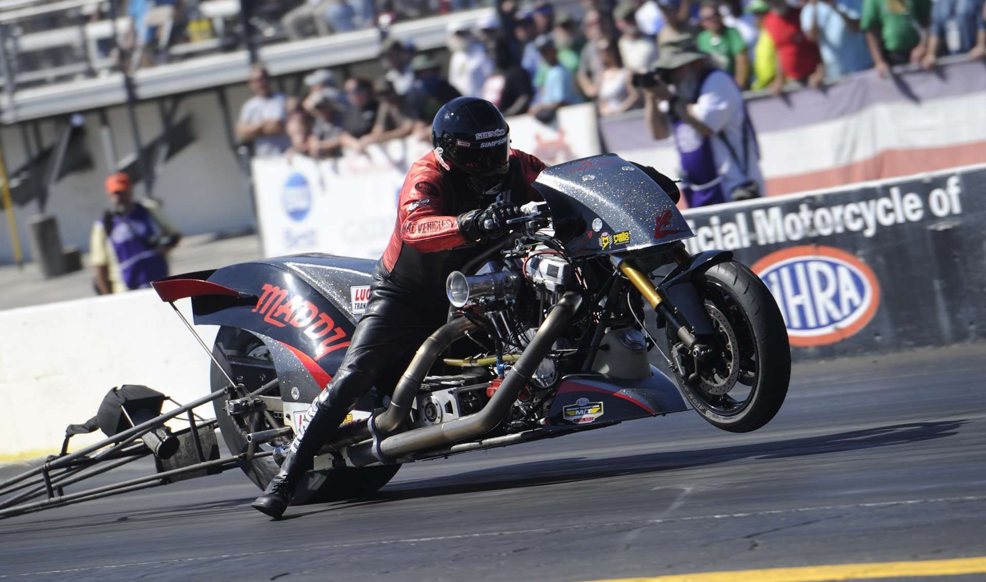 Tii Tharpe's Top Fuel Harley popping a wheelie