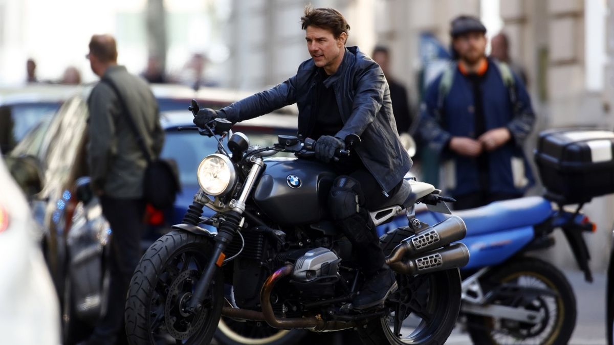 Tom Cruise riding a bike