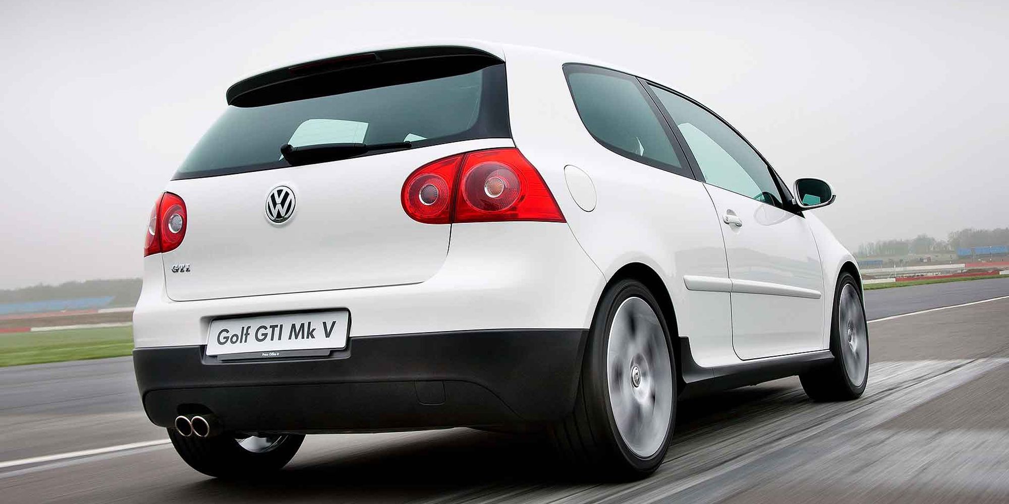 A white Mk5 Golf GTI on the move