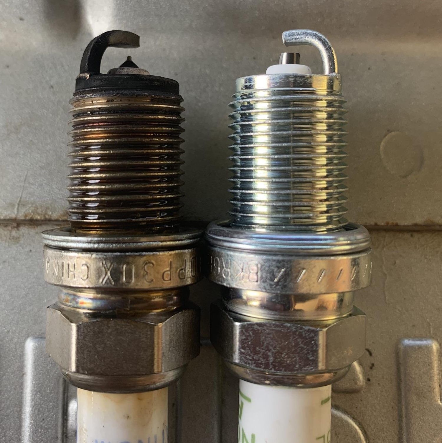 old and new spark plugs