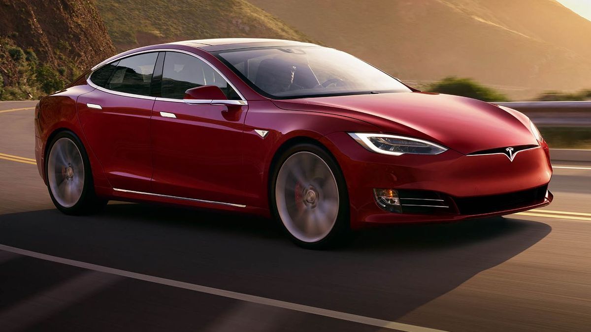 red 2020 Tesla Model S sedanon the open road