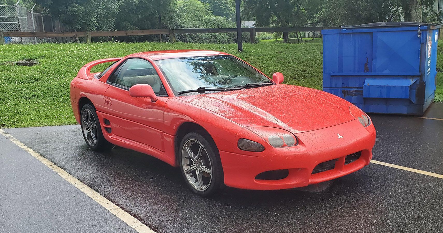 Red 1995 Mitsubishi 3000 GT parked