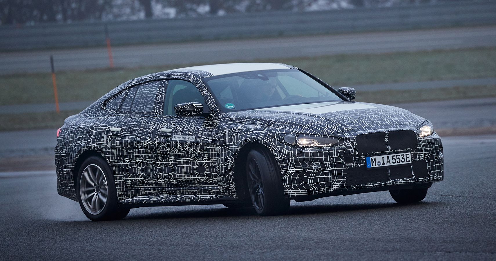 camouflaged BMW i4 prototype calibration runs steer