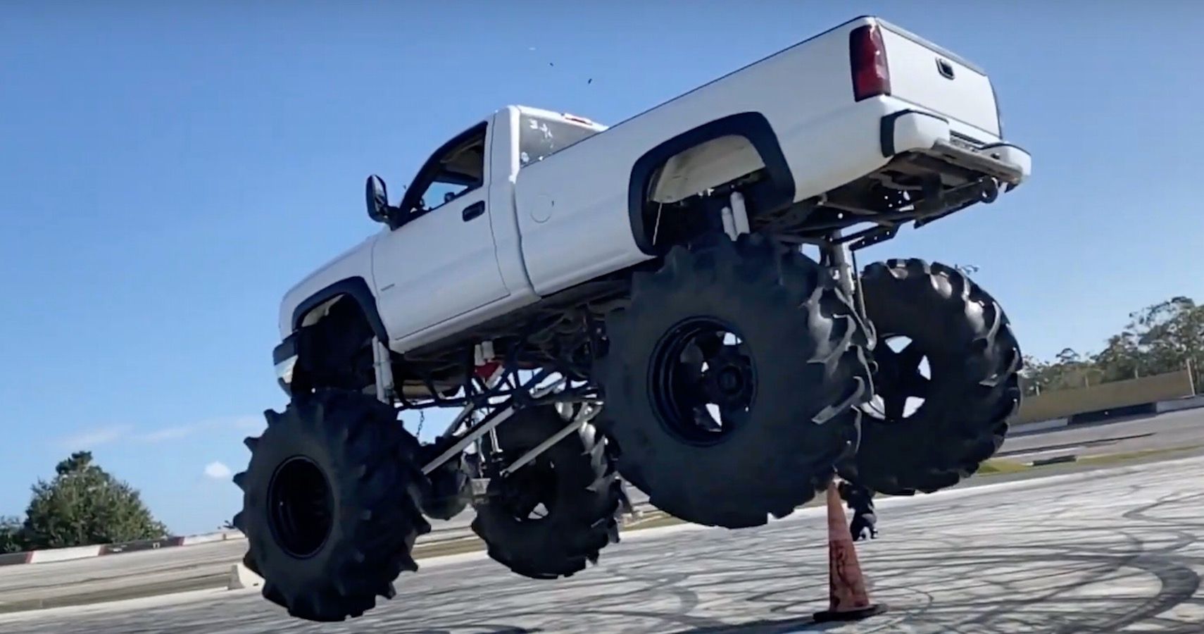 Watch This Colossal Chevy Mud-Truck Tear Down Sheds And Go Flying In Florida