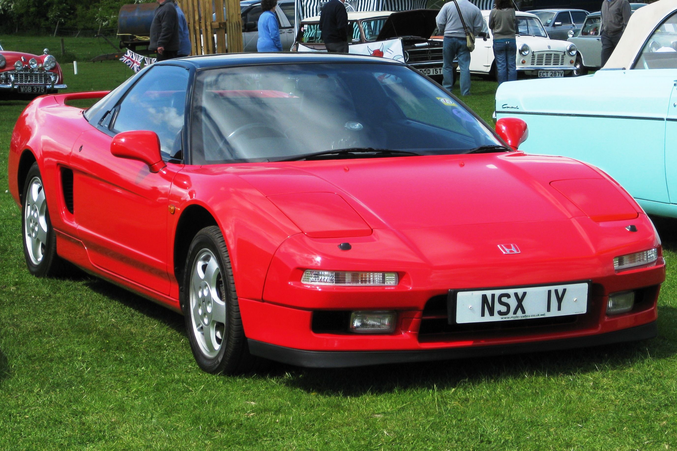 Honda NSX parked in a field