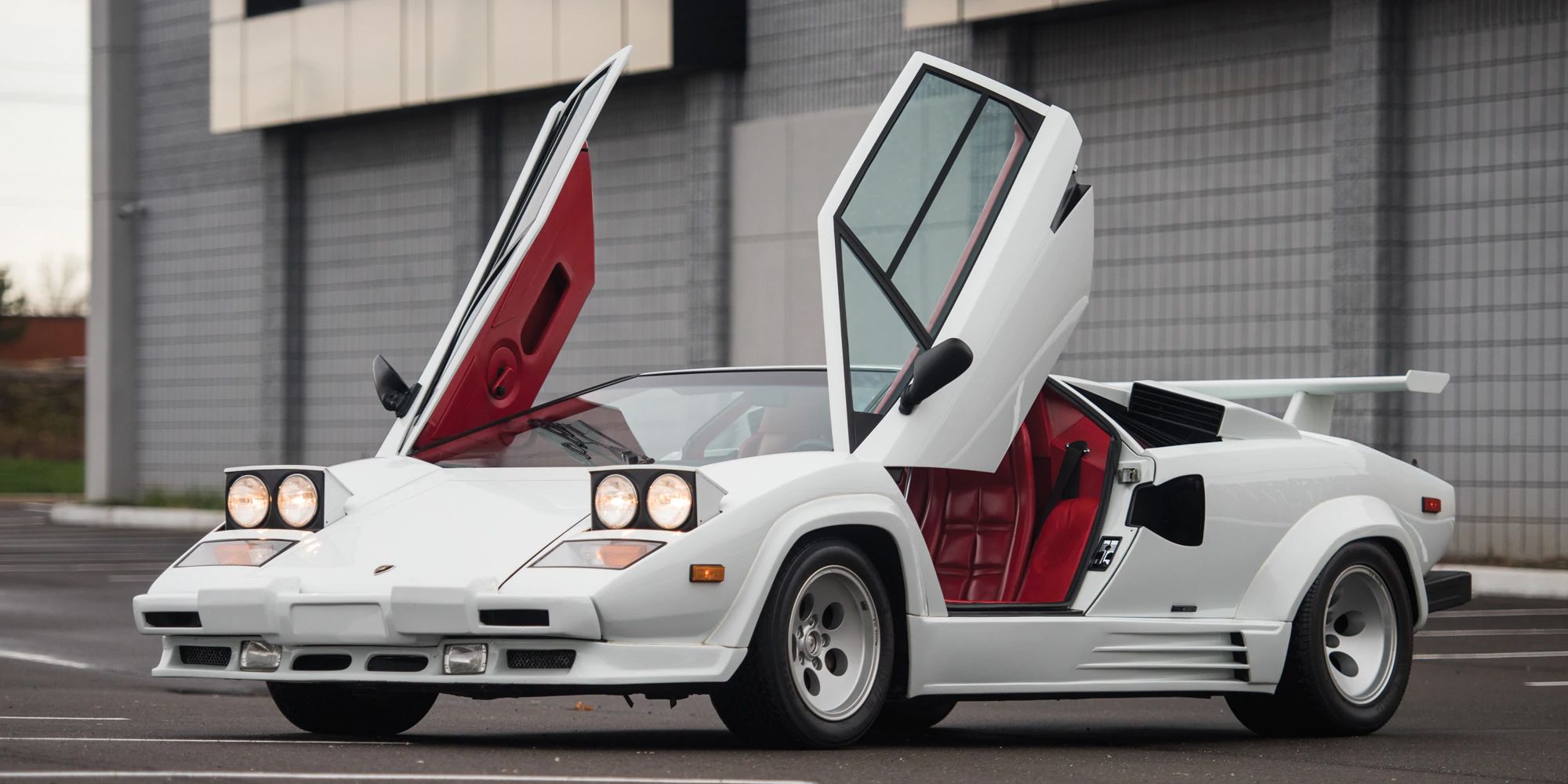 A white Countach with the doors up