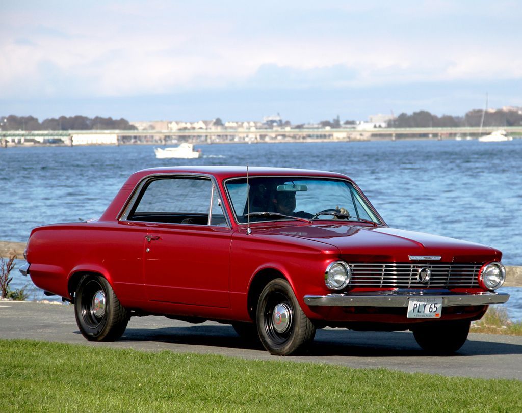 Red Plymouth Valiant by the lake