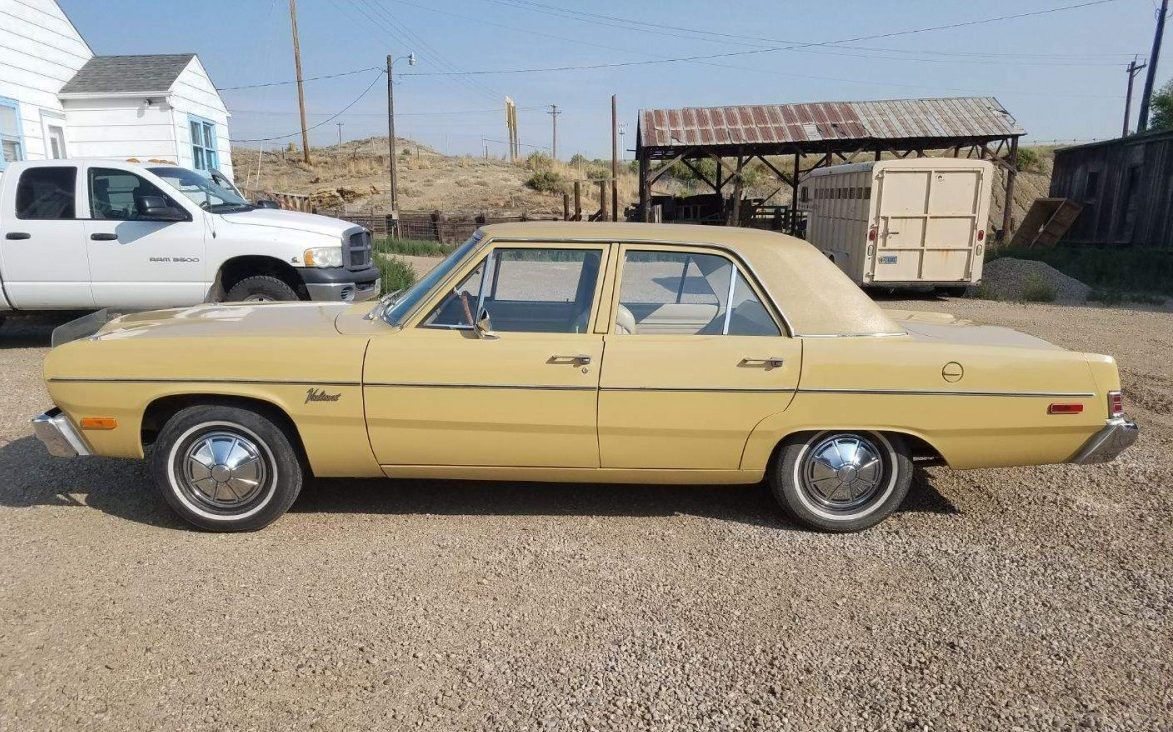 Yellow Plymouth Valiant, side view