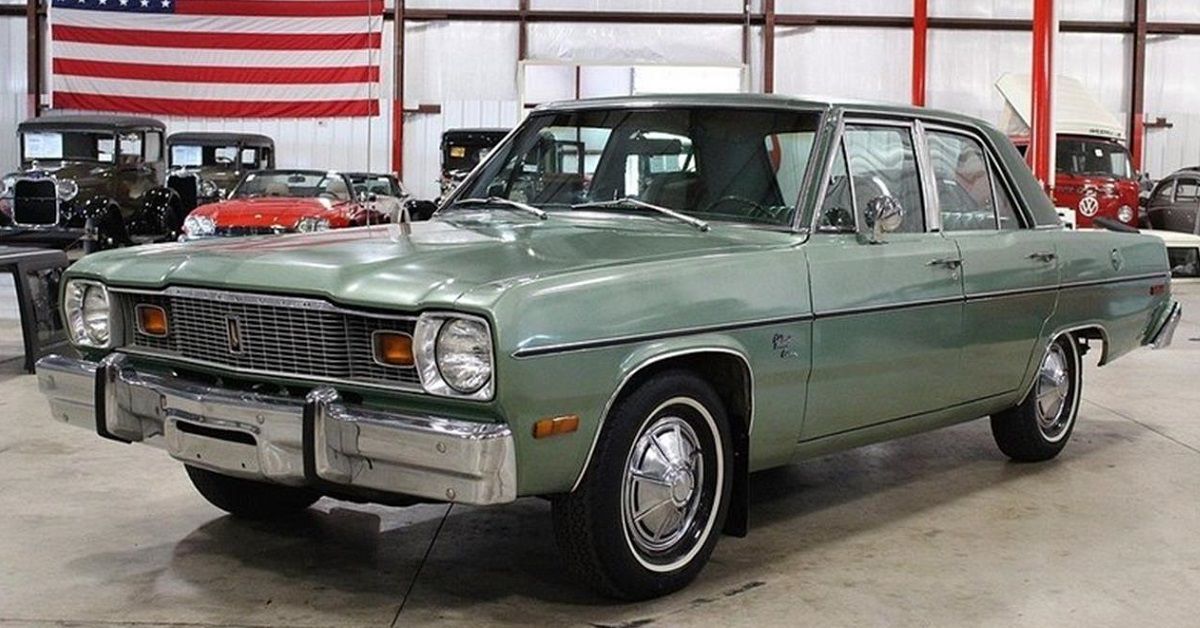 Green Plymouth Valiant in showroom