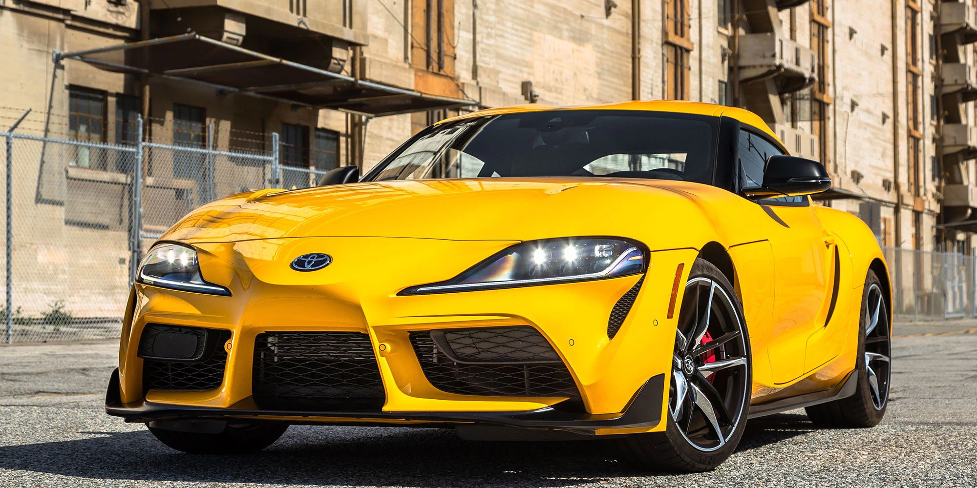 The front of a yellow Supra