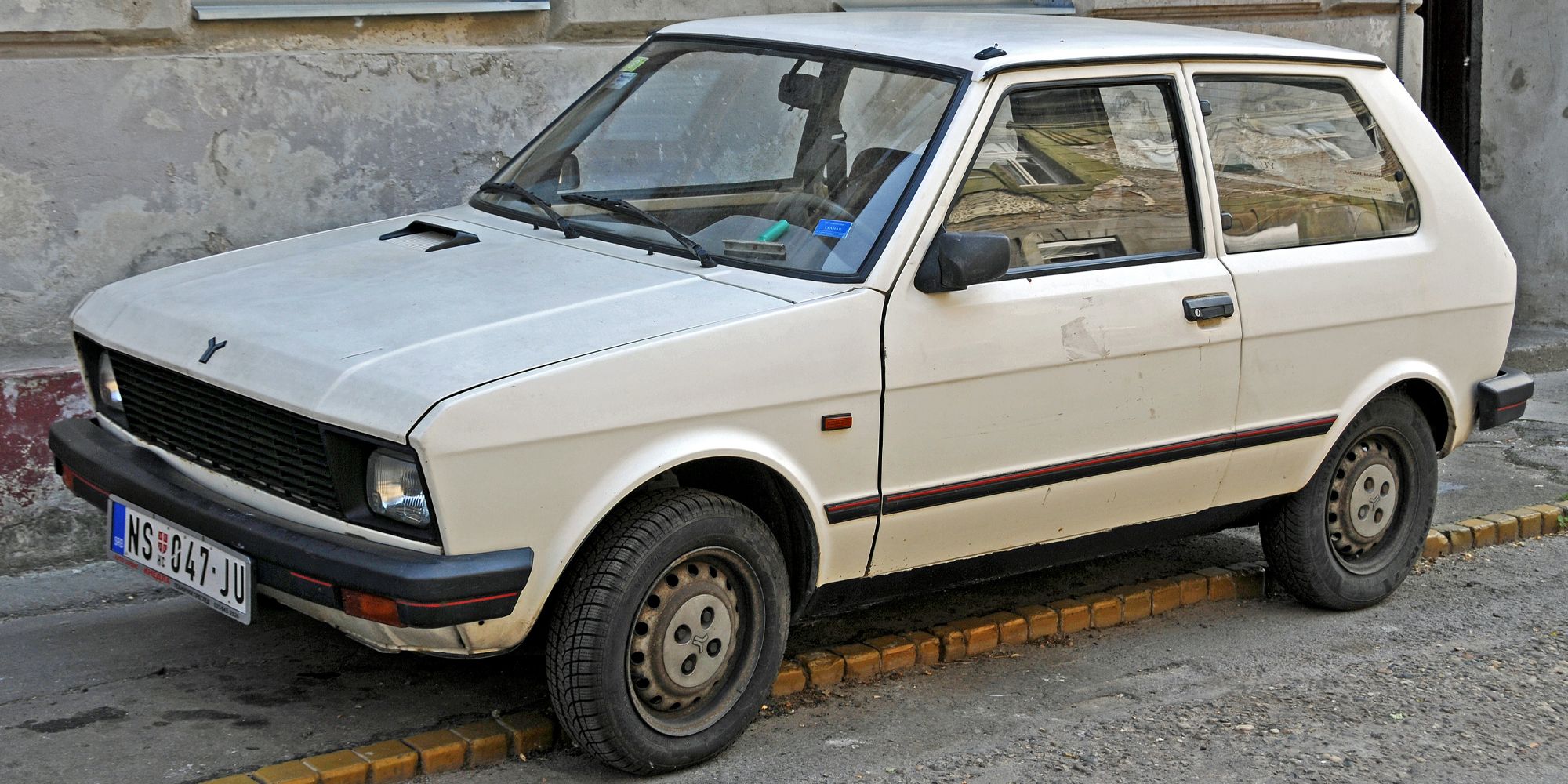 Front 3/4 view of a white Yugo