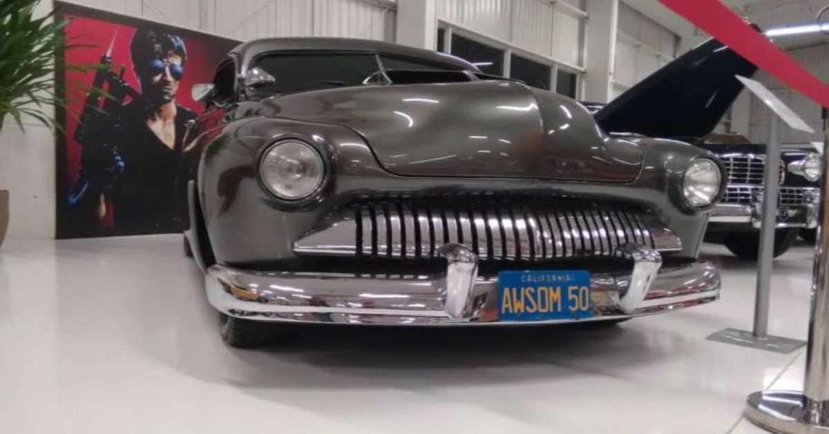 The intimidating gunmetal colored 1950 Mercury used in the Sylvester Stallone movie called, Cobra, sits on display.