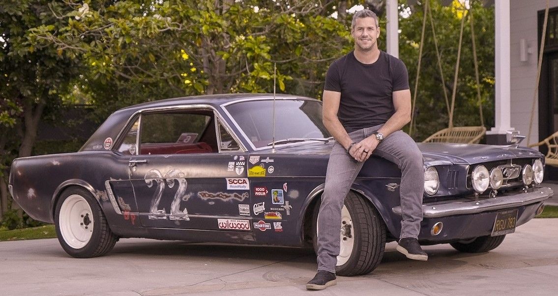 Ant Anstead stands next to 1965 Ford Mustang 1965