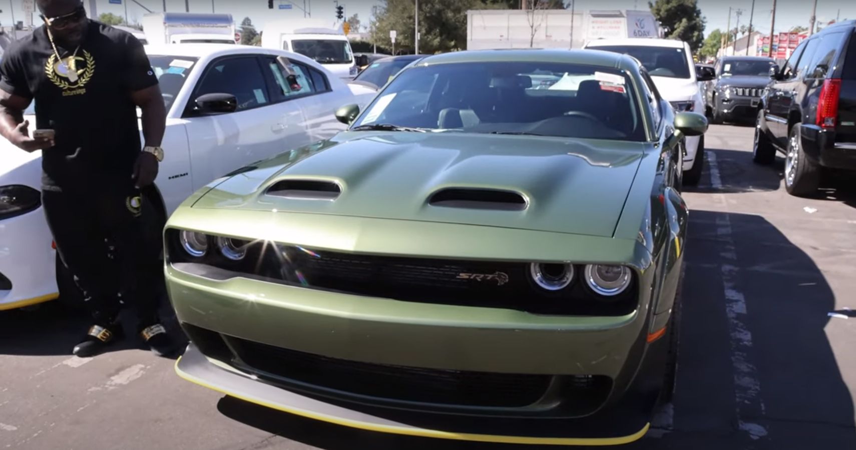 Kali Muscle poses with a 2021 Dodge Challenger Hellcat Redeye