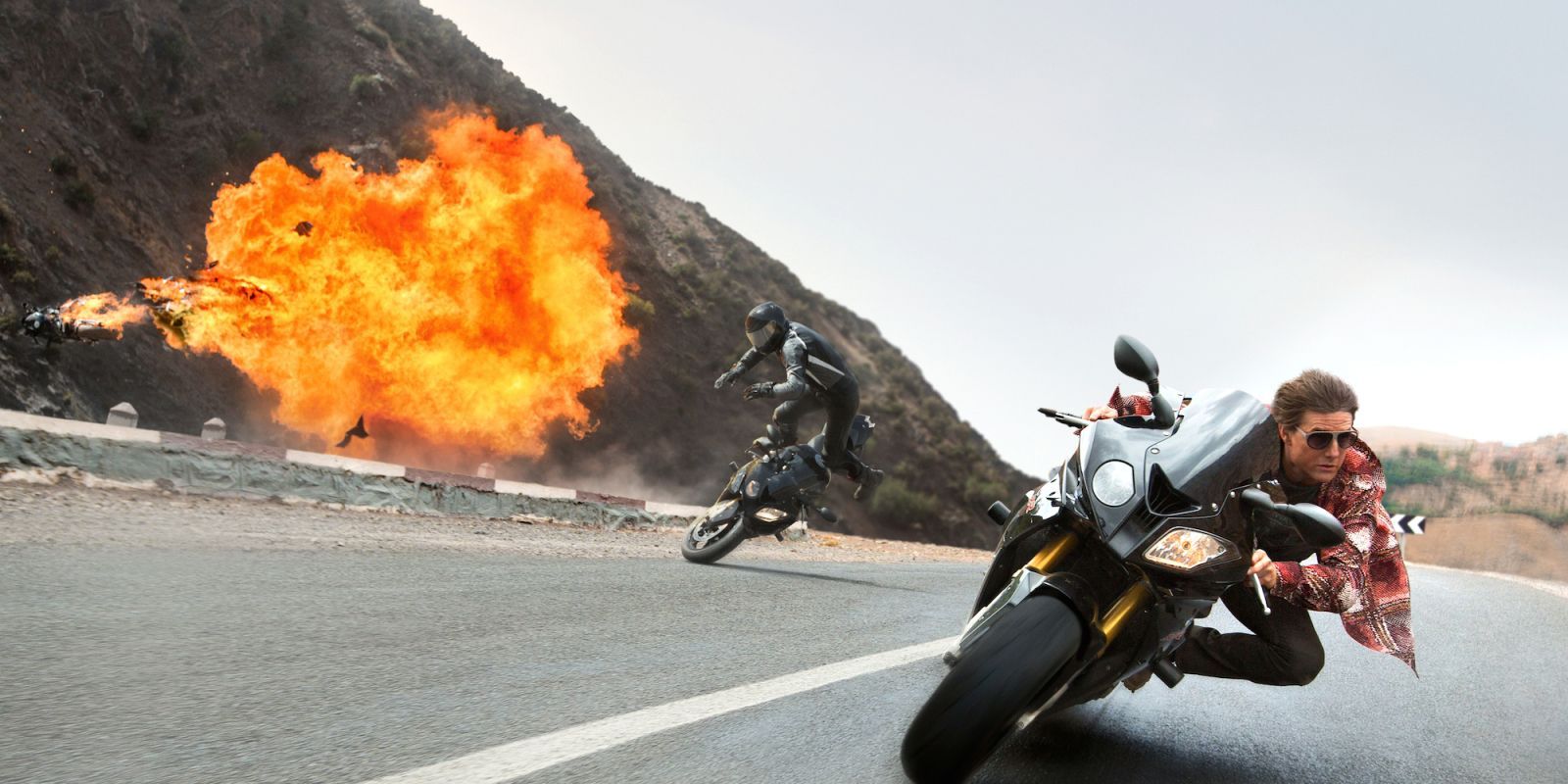 Tom Cruise riding a motorcycle in Mission: Impossible - Rogue Nation.
