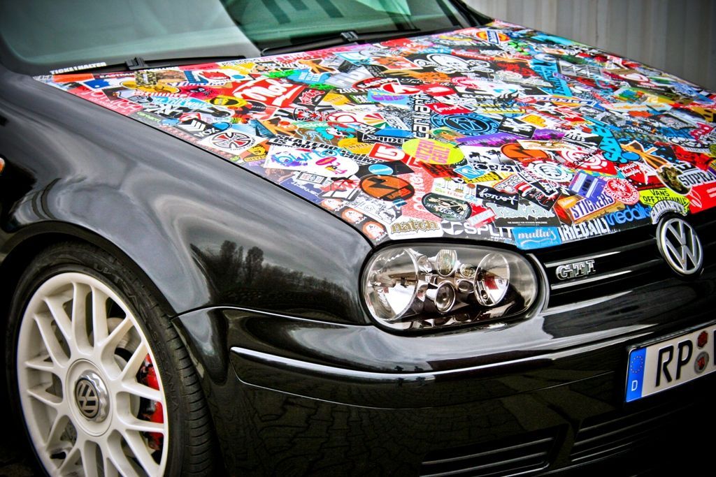 sticker bombed front hood of a car