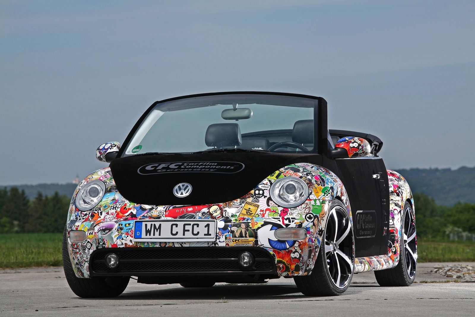 sticker bombed BMW outdoors