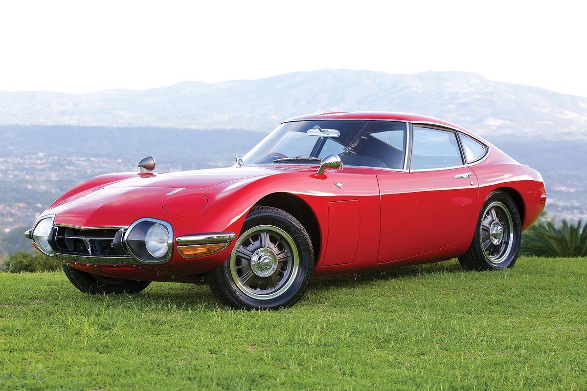Toyota 2000GT parked on the grass