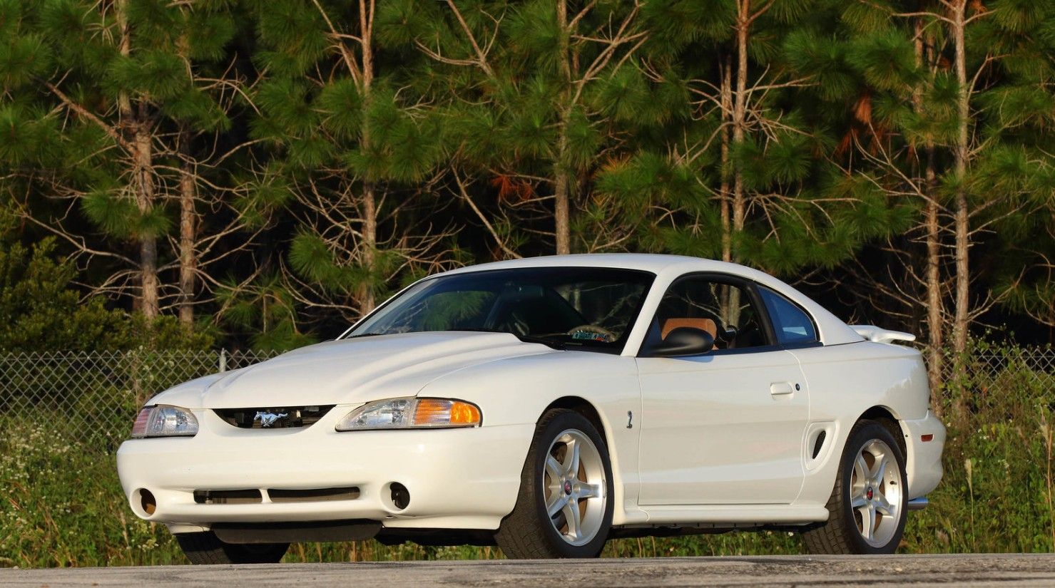 White 1995-Ford-Mustang-SVT-Cobra R parked outside