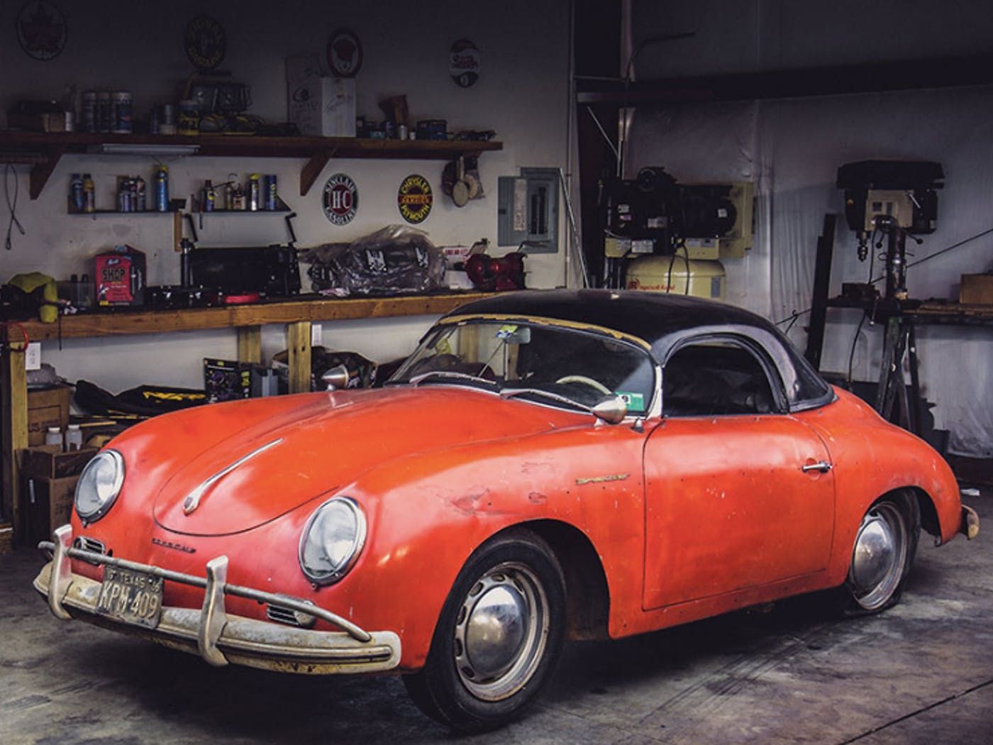 Red 1957 Porsche Speedster in shop