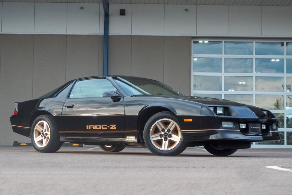 IROC-Z parked in front of a garage.