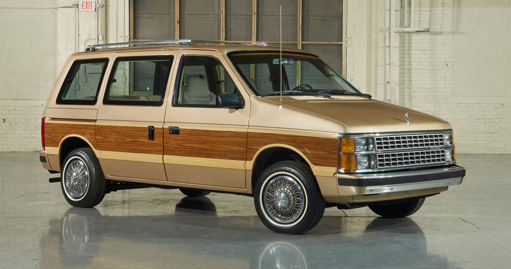 Brown 1984 Dodge Grand Caravan in a Warehouse