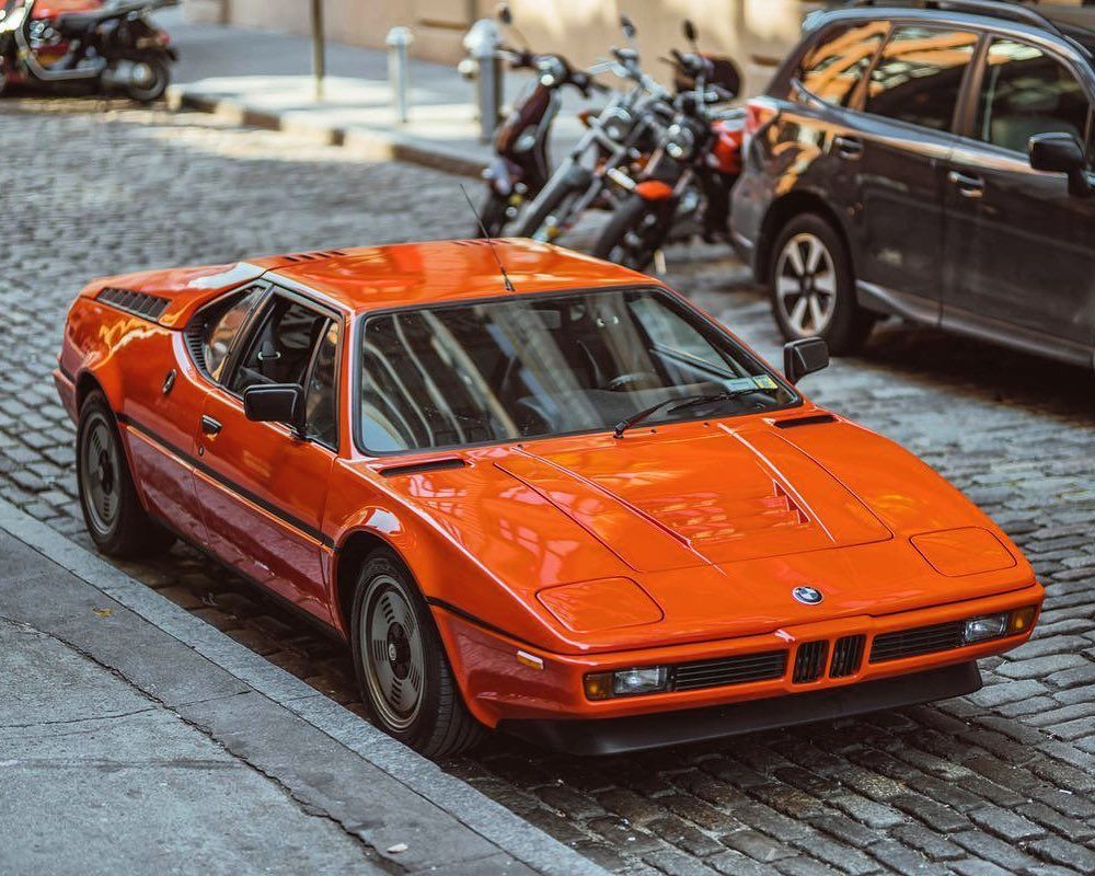 BMW M1 parked outside