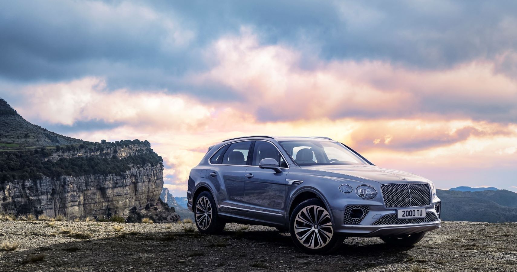 Bentley Bentayga in front of colorful sunset