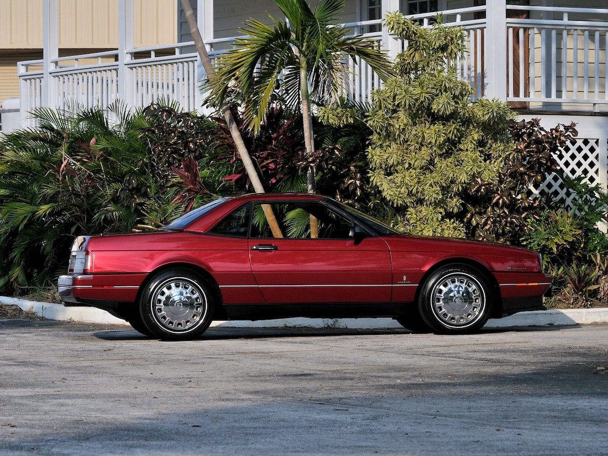 Cherry Cadillac Allante parked on a driveway