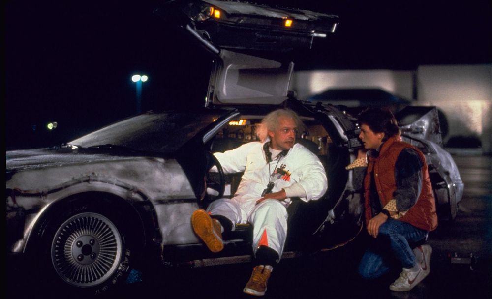Christopher Lloyd and Michael J Fox pose with the DMC-12 in Back To The Future