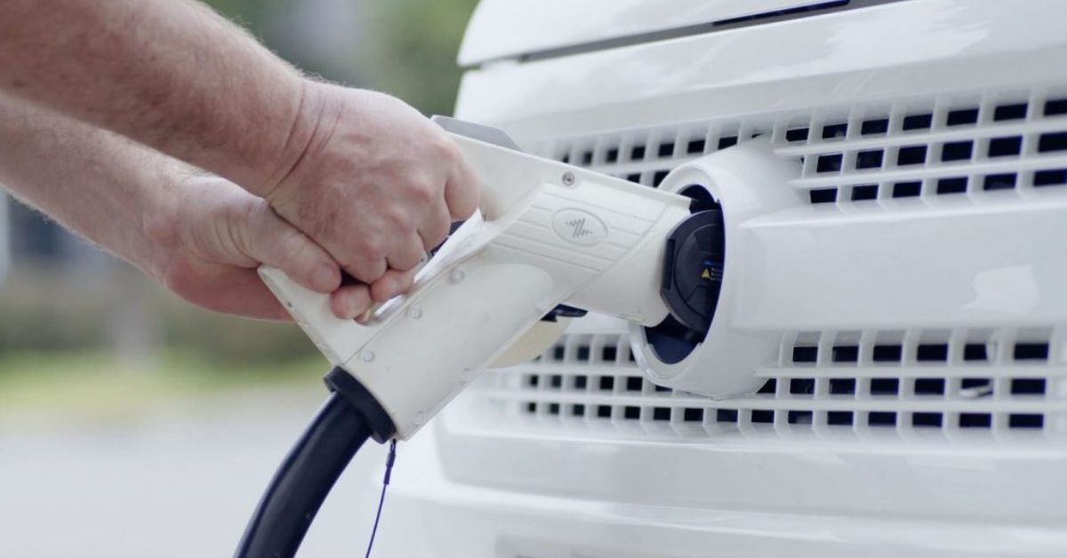 Inserting charging port into an electric van