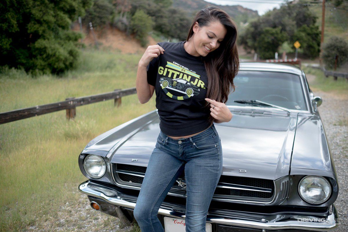 Constance Nunes and Ford Mustang, Nunes sitting against hood