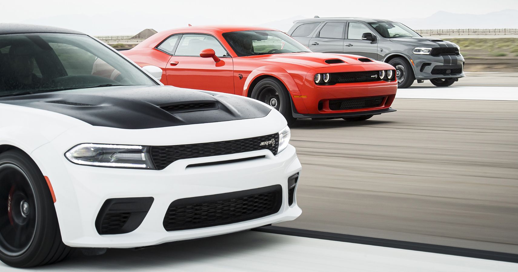 Dodge Charger Challenger Durango Hellcat lined up.