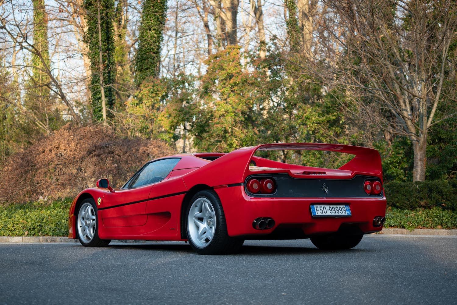 Ferrari F50 parked on vacant street left rear view