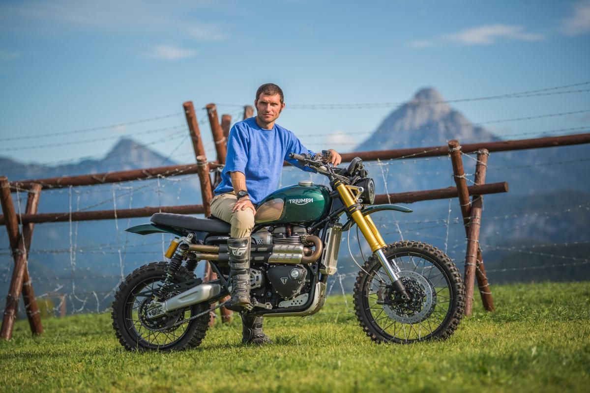 Guy Martin sitting on a Triumph motorcycle like Steve McQueen in The Great Escape