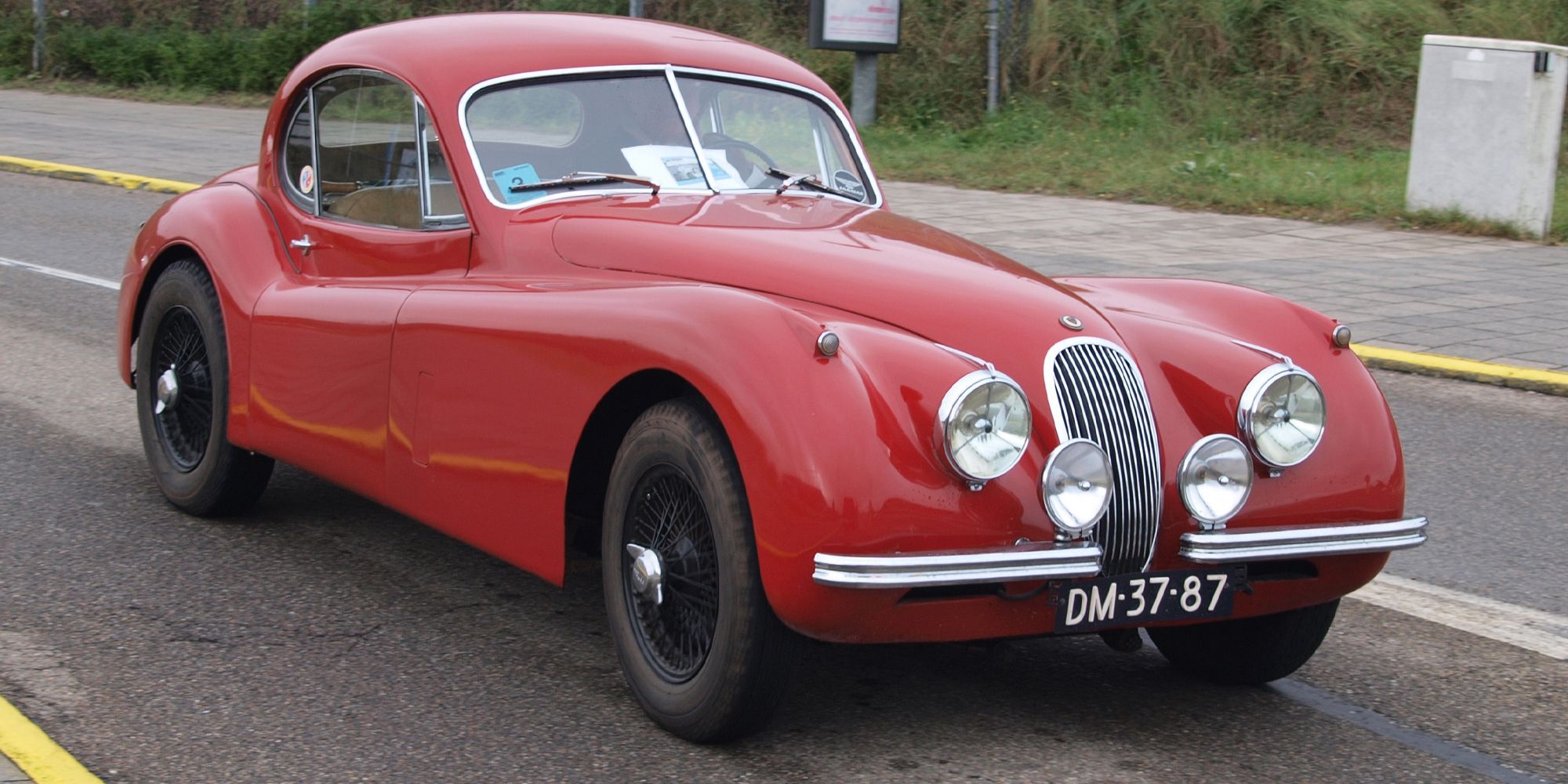 A red XK120 Coupe