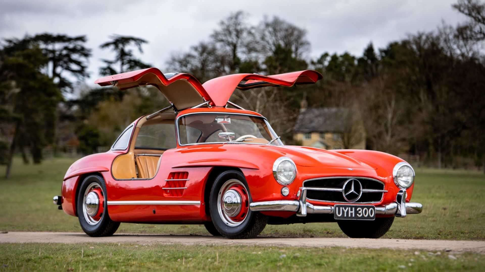red Mercedes-Benz 300 SL with gullwing doors open