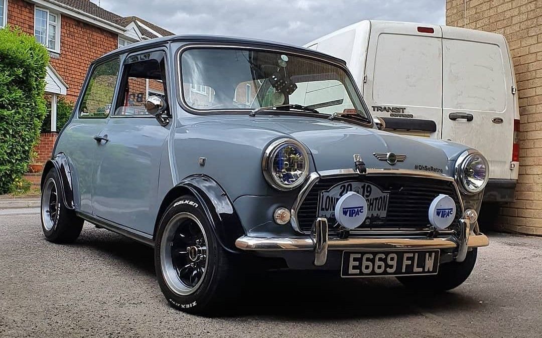 a classic Mini Cooper parked outside
